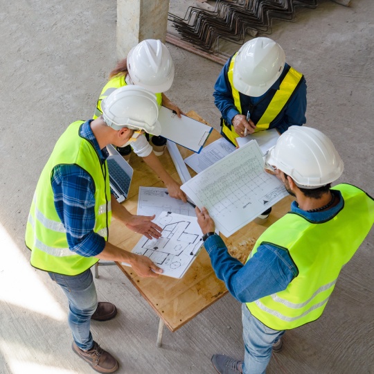 Team,Of,Civil,Technician,Engineers,Discuss,The,Timeline,With,Architect