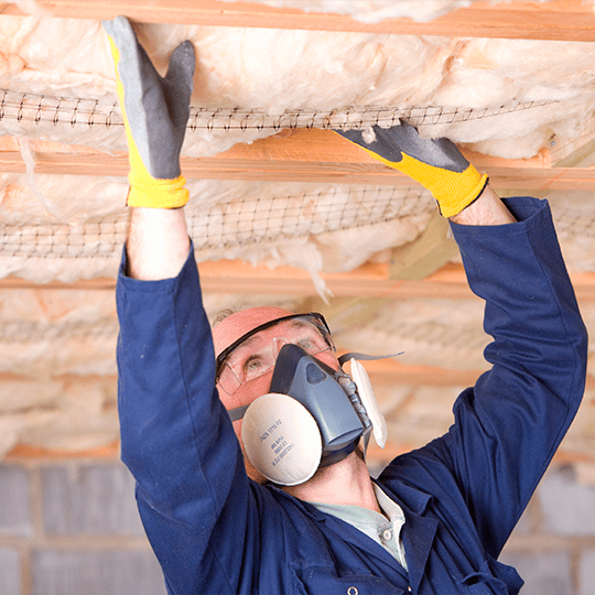 worker doing isolation. Roof job. Insulation and Sealing