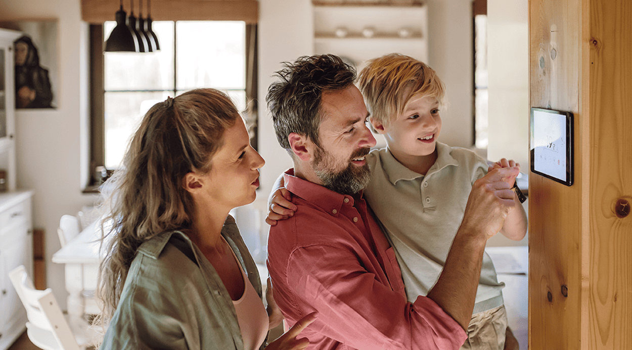 Energy-Efficient Home Design for McAllen Houses cover image: family using smart home system