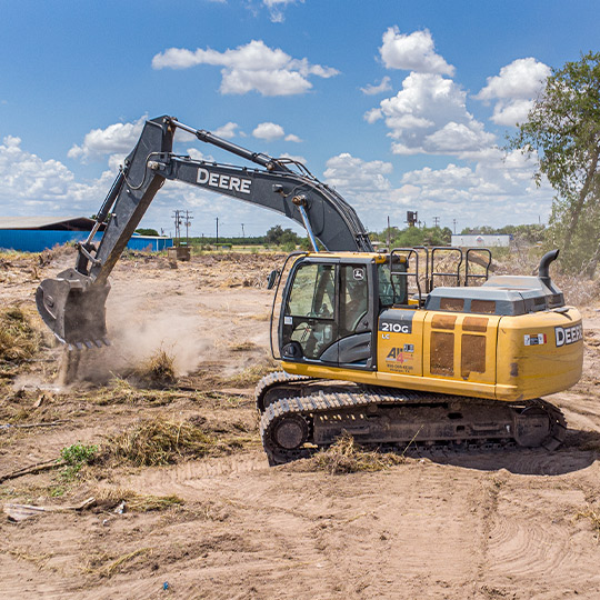  A yellow and black construction machine, essential for professional land clearing services in McAllen.