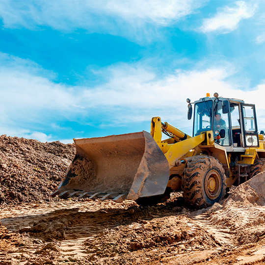 A bulldozer digs into the earth, showcasing how McAllen businesses optimize time with effective excavation techniques.