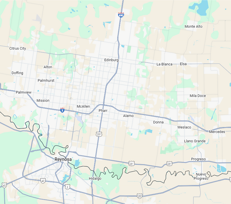 A bulldozer is actively working on a dirt road for a commercial construction project in McAllen.