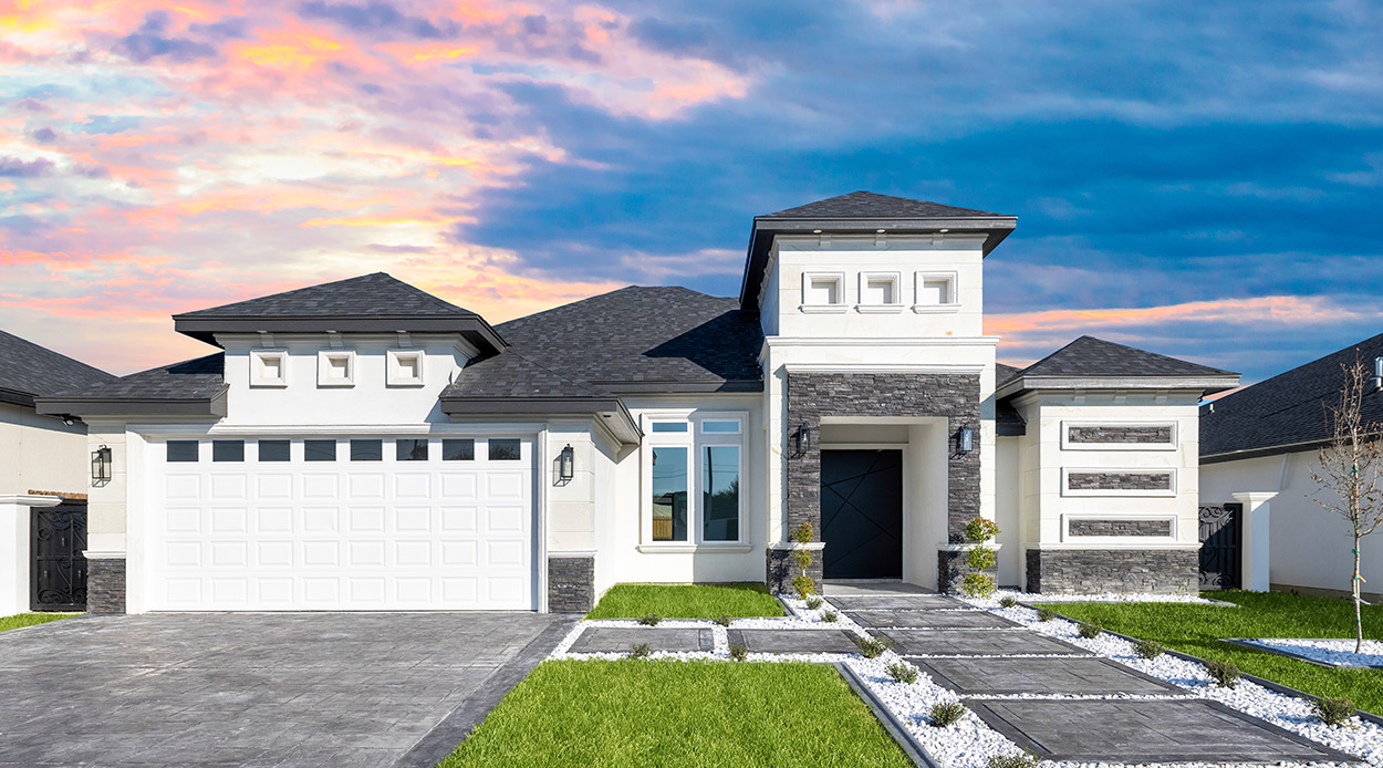An elegant house with a driveway and garage, reflecting the latest exterior design trends for McAllen, TX homes in 2026.