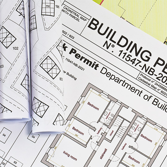  A building permit alongside a detailed building plan for a custom home project in McAllen, TX, focusing on costs.